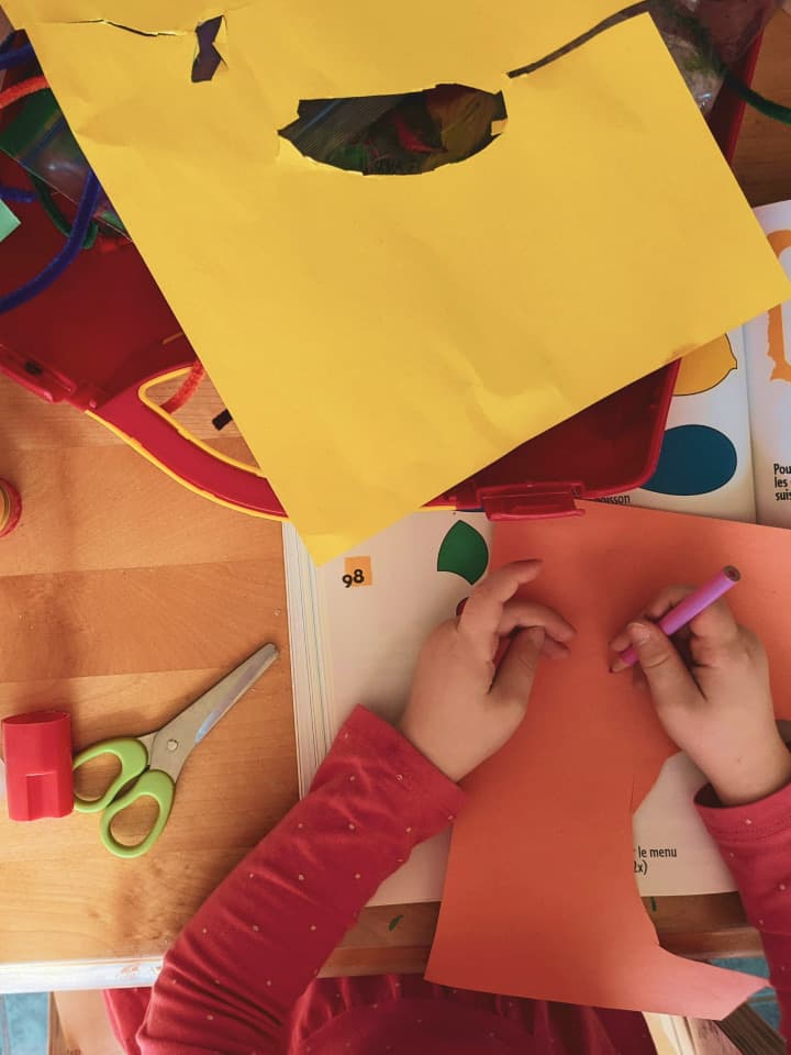 Smiling child with headphones — parents use Kifolio to build a digital portfolio of their child’s milestones and achievements