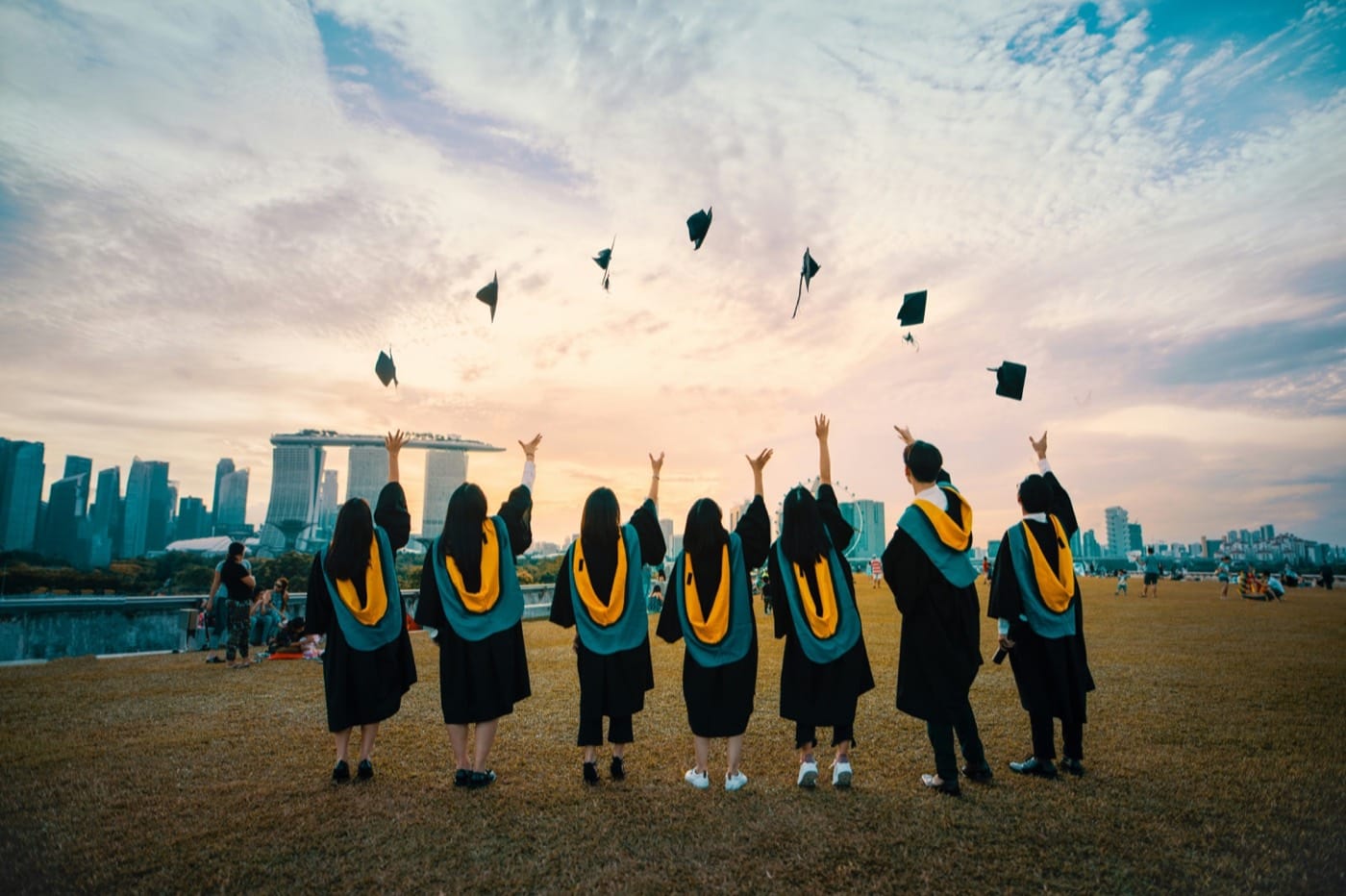 Graduate in cap and gown — building a student portfolio through school helps families prepare for college applications